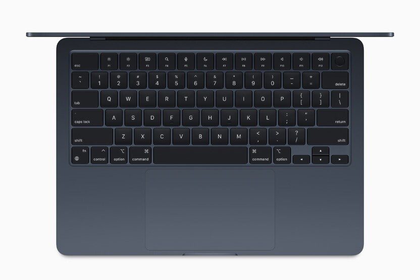 Top-down shot of MacBook Air’s keyboard and Force Touch trackpad in midnight.